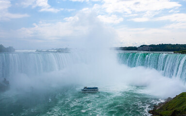 Peasure boat with tourists near Niagara Falls