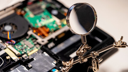 the master solders the chip with a soldering iron