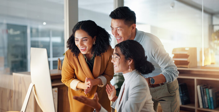 Business, people and celebrate for teamwork success, support and collaboration with computer in office. Celebration, man and women happy together with pride or congratulations for work feedback