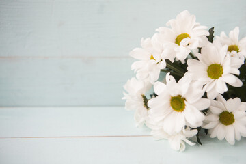 bouquet of white chrysanthemums, wooden background, copy space