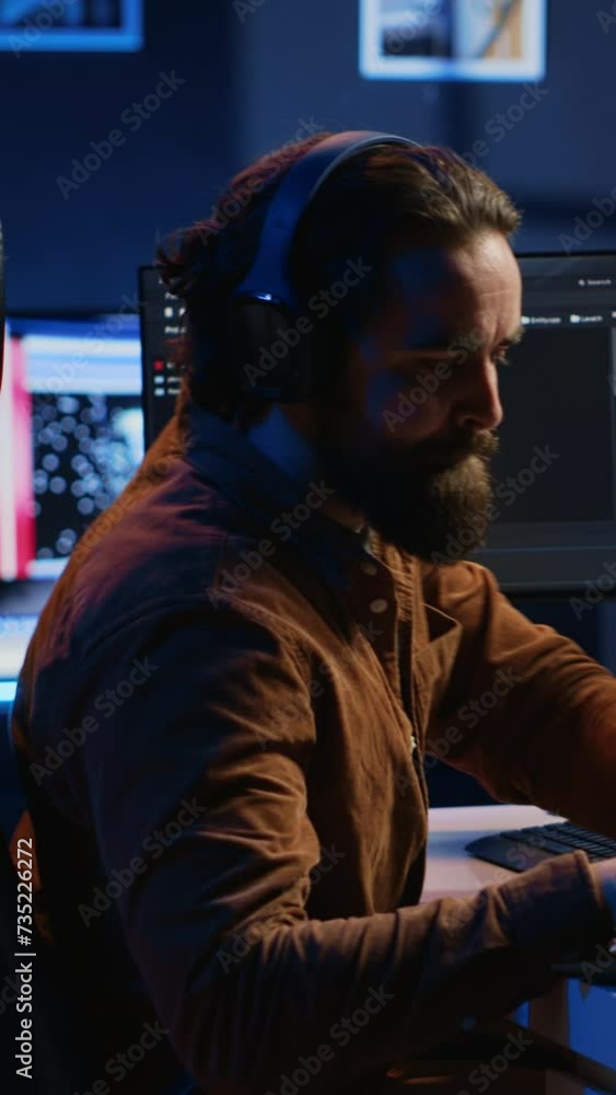 Poster programmer does multitasking to finish developing pc code, drinks coffee, listens music. it admin we