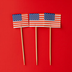 american flags on stick or toothpicks on red backgrou