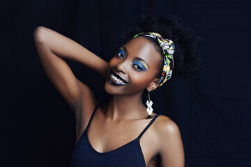 African female person, fashion and studio for makeup, lipstick and smile for eye shadow. Black woman model, dark background and cosmetic, portrait and face for cultural, style and elegance