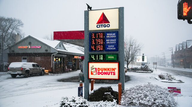 NORWALK, CT, USA - FEBRUARY 13, 2024: Citgo gas station with coffee shop during  snowstorm in February 2024 on East Coast.