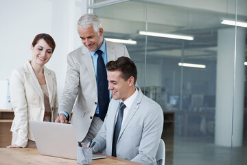 Computer, discussion and business people in office for research on corporate legal project in collaboration. Team, technology and group of attorneys work on case with laptop in workplace boardroom.