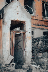 old broken door of a destroyed house in Ukraine