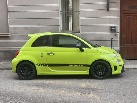 green fiat 595 competizione tuned abarth parked in the street