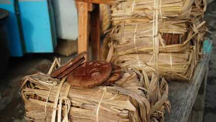 brown sugar packed with dried leaves