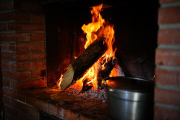 Warm fire on the chimney in a cold day