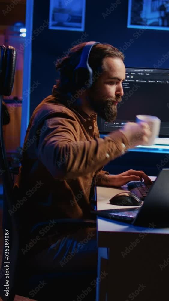 Aufkleber programmer does multitasking to finish developing pc code, drinks coffee, listens music. it admin we