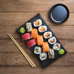 Sushi set on a wooden background, top view, copy space
