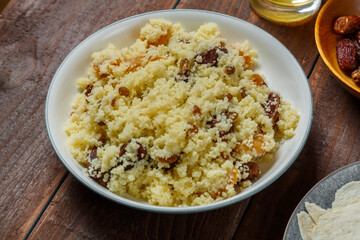 Couscous with dried fruits and nuts on the festive table