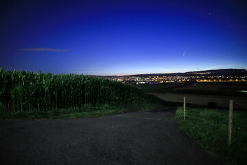 comet neowise above the city of Wohlen, Switzerland