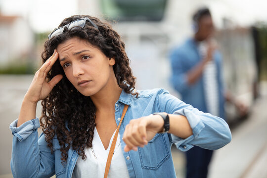 young woman in hurry to catch train