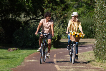 people in love riding together on the same bicycle