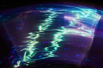 Long exposure photo of vibrant colours on a black background. Multicolored dynamic Light painting....
