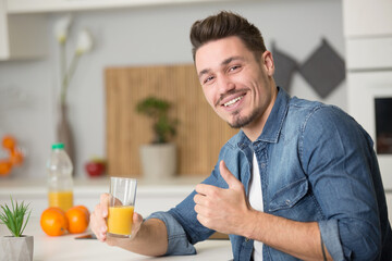handsome man drinking orange juice