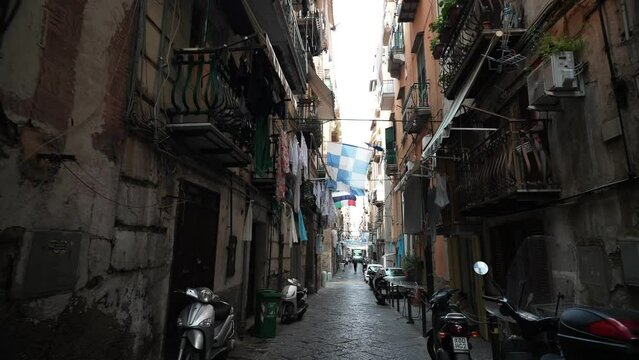 Naples, Italy - May 7, 2023: a street in the old historic center of Naples, Italy. Naples, center of city old Spanish quarter street with famous landmark, touristic attraction street art
