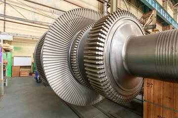 Assembly of a steam turbine rotor in a plant workshop.