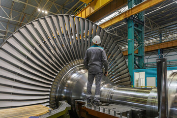 Assembly of a steam turbine rotor in a plant workshop.