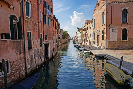Scenic Venice, Italy canal on a sunny, peaceful afternoon with no tourist crowds.