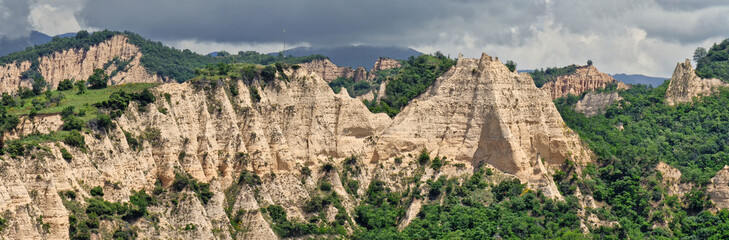 Sandstone pyramids near the town of Melnik, Bulgaria - 735341224