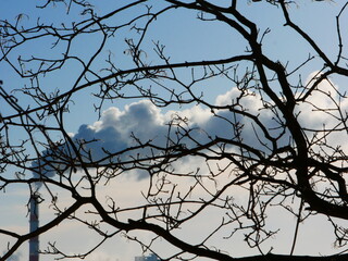 A smoking chimney against the sky.