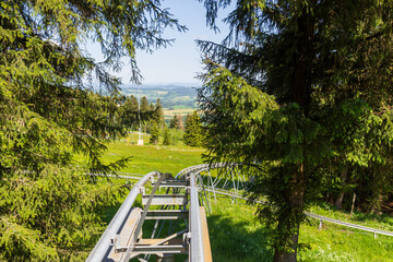 First person view of rollercoaster ride at mountain Wasserkuppe with mountain panorama in Rhön...