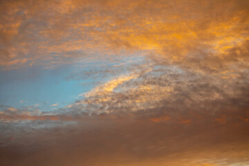 Beautiful idyllic sky at dawn with strong yellow and orange colors