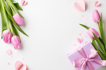 Women's Day: Petals and presents in harmony. Top view photo of blooming pink tulips, a purple gift box with a delicate ribbon, and playful confetti on white backdrop with space for celebratory words