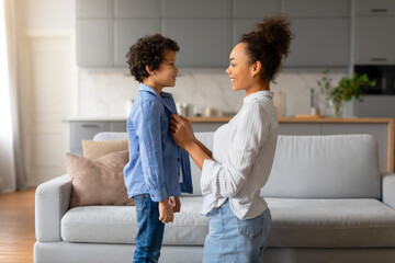 Black mother and son sharing moment, with loving eye contact