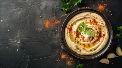 Tuinposter Hummus delicious middle east cousine, tasty paste made from cooked and pureed chickpea seeds © AdamantiumStock