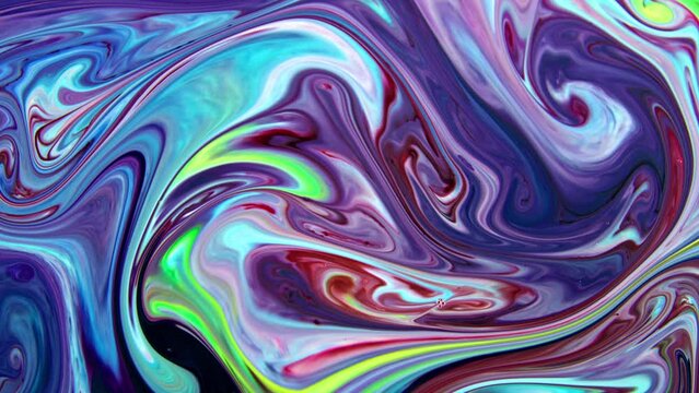 This stock video features an extreme close-up shot of A thick mixture of colored liquid paints spreading on the surface in slow motion that can be used as an organic background for visual effects.