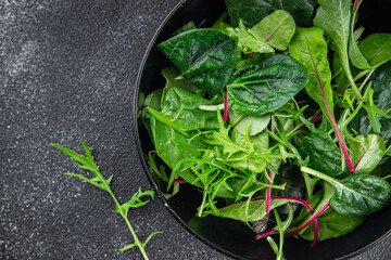 Healthy green salad mix, leaves  juicy snack healthy eating cooking appetizer meal food on the table copy space food background rustic 