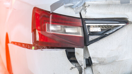 Damage to rear bumper of car after accident.