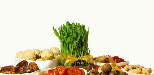 Green wheat sprouts with sweets, nuts, dried fruits. The traditional celebration of the spring equinox in March.