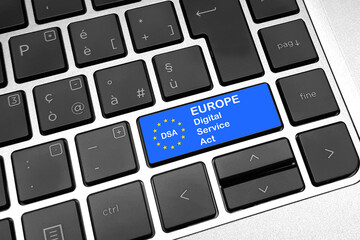 Digital services act (DSA) concept: enter key on computer keyboard with europe flag, and the text...