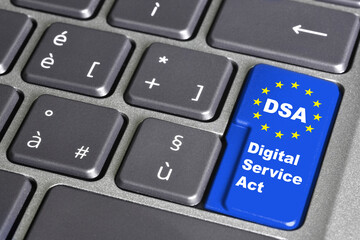 Digital services act (DSA) concept: enter key on computer keyboard with europe flag, and the text "DSA" Digital Services Act