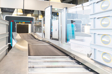 Security baggage scanners and gates with metal detectors at airport