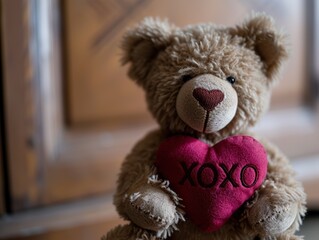 Teddy bear with a "xoxo" heart on a blue background. Valentine's Day.