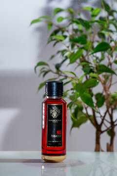 Kiev Ukraine 5 February 2024: Red Tobacco Mancera luxury perfume. Product photography composition for a perfume boutique. illustrative editorial picture