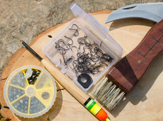 Spring fishing. Fishing tackle on a stone near the Dnieper River.