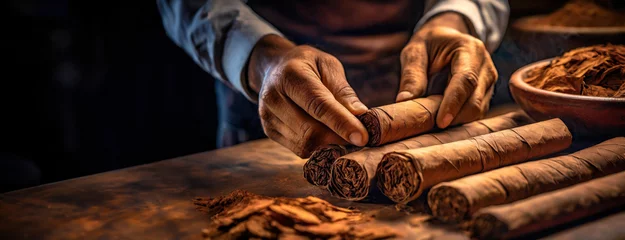 Rolgordijnen Skilled hands of mature man craft cigars on a vintage wooden table, surrounded by tools and raw tobacco, evoking a sense of tradition and craftsmanship. © vidoc