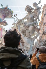 Fototapeta premium view from behind, a people view the impresionant monument of las fallas festivity in Valencia