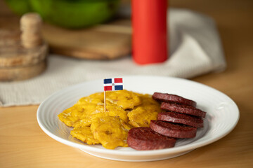 dominican fried plantains and salami with a flag
