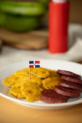 dominican fried plantains and salami with a flag