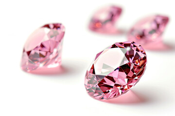 Group of Pink Diamonds on White Surface