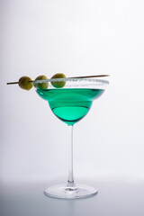 single cocktail with decoration on white background