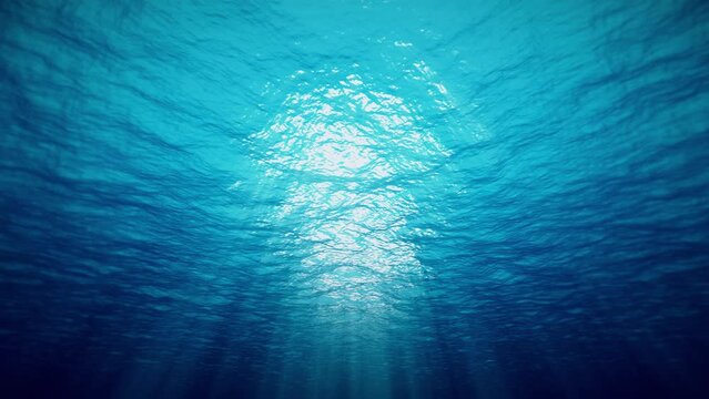 Ocean underwater waves deep blue ripple and flow with light rays. 4K seamless loop	