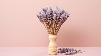 An elegant arrangement of baby hairbrushes with minimalist wooden handles, displayed on a pale lavender background with subtle floral accents.